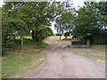 TM2446 : Entrance to Broomfield's  Farm buildings &  footpath to the A12 Martlesham Bypass by Geographer