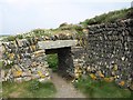 SW8976 : Sheep hole near Porthmissen Bridge by Derek Harper