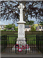 NJ4722 : War memorial with park and houses in Lumsden by Trevor Littlewood