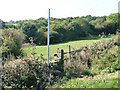 SE2307 : Footpath sign and stile, Lower Denby Lane by Christine Johnstone