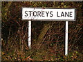 TM2575 : Storeys Lane sign by Geographer