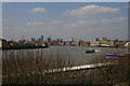 TQ3680 : Looking upriver from the terrace above Canary Wharf Pier: riverbus approaching by Christopher Hilton