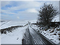 SD8073 : The road to High Birkwith in the snow by John S Turner