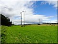 NZ2536 : Powerlines beside the river by Robert Graham