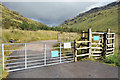 NN2309 : Gated entrance to the estate road in Glen Kinglas by Steven Brown