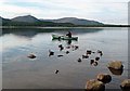 NH9709 : A canoeist on Loch Morlich by Walter Baxter