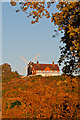 TQ2350 : Reigate Heath Windmill and Reigate Heath Golf Club clubhouse by Ian Capper