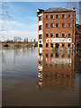 SO8454 : Former warehouse and floodwater by Philip Halling