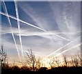 SJ9594 : Contrails at sunrise by Gerald England