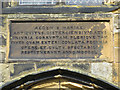 TA0489 : Latin plaque above St Mary's south door by John S Turner