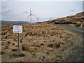 NG3546 : Wind farm signpost by Richard Dorrell