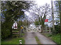 TM4072 : Level Crossing on the entrance to South Manor Farm by Geographer