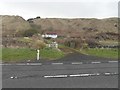 NX1188 : A little wooden cottage beside the A77 by Ann Cook