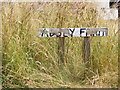 TM3186 : Abbey Farm sign by Geographer