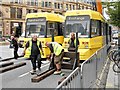 SJ8498 : Mock Trams in Exchange Square by David Dixon