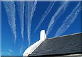 SN1952 : Contrails above the church at Mwnt by Dave Croker