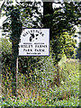 TG2505 : Bixley Park Farms sign by Geographer