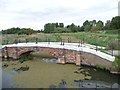 SK9571 : Foss bank footbridge over catchwater drain by Christine Johnstone