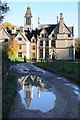 SO8001 : Woodchester Mansion reflected in a puddle by Philip Halling