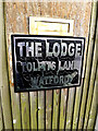 TQ0994 : The Lodge sign by Geographer