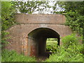 SY1097 : Railway bridge under the old A30 by Anthony Vosper