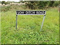 TM2786 : Low Ditch Road sign by Geographer