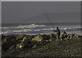 SN6089 : Fisherman battling the wind, Borth by Chris Denny