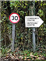 TM3555 : Roadsign & Tunstall Community Centre sign by Geographer