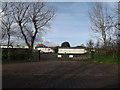 TM4657 : Entrance to Church Farm Holiday Park by Geographer