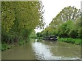 ST8559 : Very fat narrowboat moored alongside Widbrook Wood by Christine Johnstone