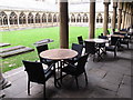 SK9771 : Lincoln cathedral cloisters with cafe tables by David Hawgood