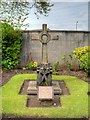 SJ4893 : Cross in Church Garden by David Dixon