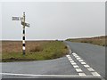 NY2637 : Signpost on Aughertree Fell by Christine Johnstone