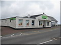 NM0444 : The co-operative store and bank at Scarinish by M J Richardson