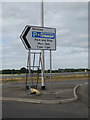 TL9929 : Roadsign on the Roundabout by Geographer