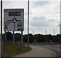 TL9928 : Roadsign on Axial Way by Geographer