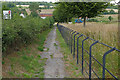 TQ0648 : Footway by the A248 by Alan Hunt