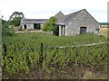 TL0995 : Disused farm buildings on Wansford Road by Richard Humphrey