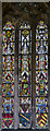 SK9303 : Medieval stained glass, St John the Baptist, North Luffenham by Julian P Guffogg