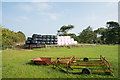 NZ0258 : Bales, pink and black by Trevor Littlewood