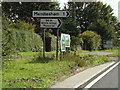 TM1165 : Roadsigns on the A140 Norwich Road by Geographer