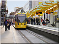 SJ8498 : Tram at Exchange Square Metrolink Stop by David Dixon