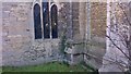 TL1997 : Ordnance Survey Benchmark and Bolt - Fletton, St. Margaret's Church by N Scott