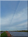 TL2598 : Contrails over the River Nene by Mat Fascione