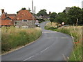 TL9978 : Entering Hopton on the B1111 Bury Road by Geographer