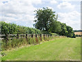 NZ3144 : Field bounded by wooden fence by Trevor Littlewood