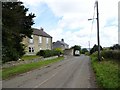 NZ1443 : Looking east along the main street in Cornsay by Robert Graham