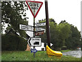 TL9367 : Roadsigns on Fen Road by Geographer