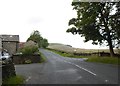 SD8492 : Road junction at Collier Holme farm by David Smith