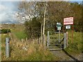 NS4374 : The Crags Circular Path leaving a farm road by Lairich Rig